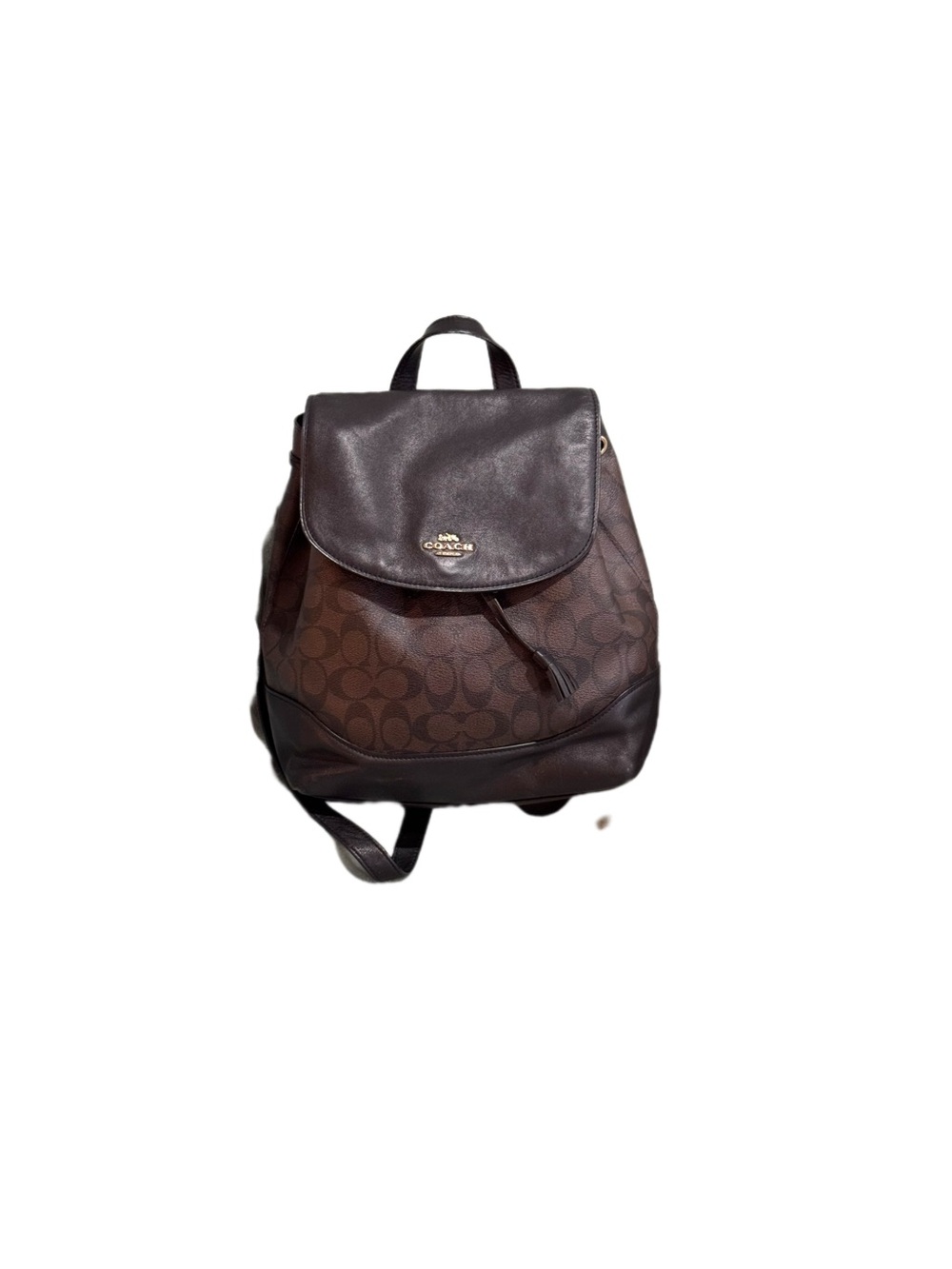 Coach Elle backpack featuring a signature canvas print and smooth leather trim.